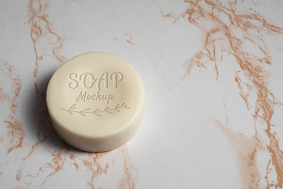 موکاپ لوگو روی صابون شیری رنگ در بکگراند سنگ مرمری
